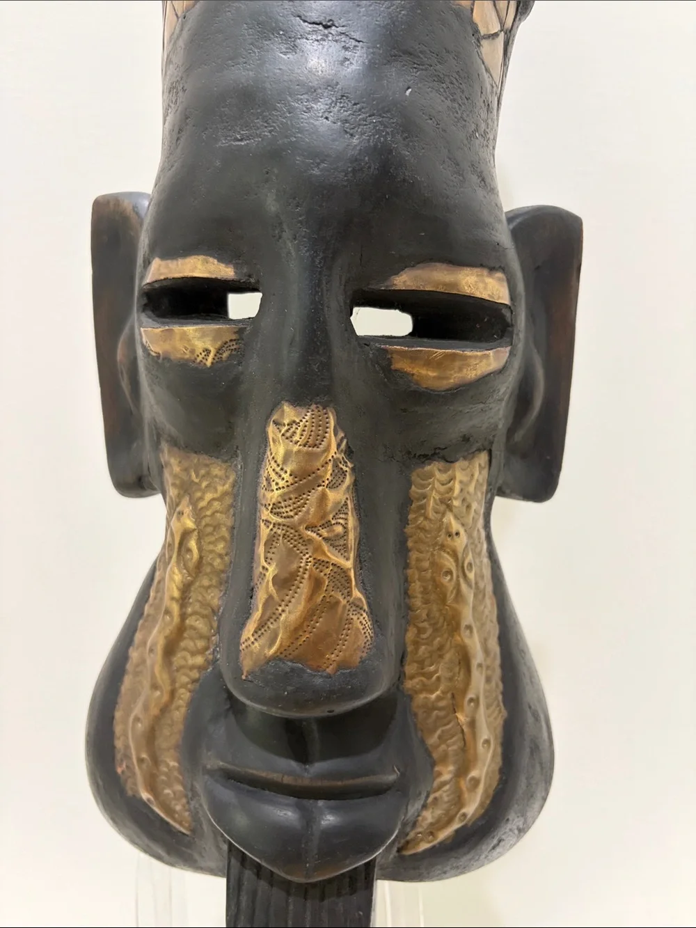 Hand-Carved Black and Brass Tribal Mask from Ghana